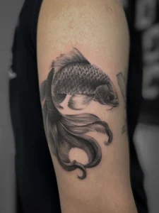 Koi fish tattoo in realism by oleg.r.tattoo Calgary