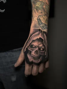 Reaper tattoo on hand dark realism by oleg.r.tattoo Calgary