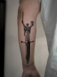 Ukrainian dagger tattoo by oleg.r.tattoo in Calgary
