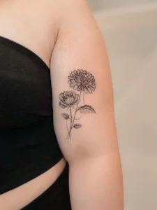 delicate-chrysanthemum-and-rose-arm-tattoo-calgary