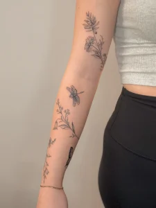 floral-dragonfly-fine-line-arm-tattoo-calgary