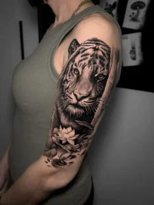 tiger and lotus realistic tatoo by oleg.r.tattoo Calgary