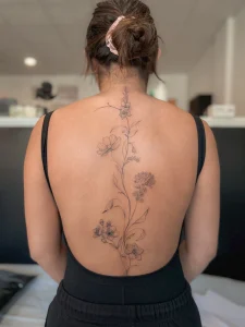 vertical-floral-backpiece-fine-line-tattoo-calgary